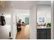 Apartment hallway leading into a living space with hardwood floors and modern finishes at 130 26Th Nw St # 511, Atlanta, GA 30309