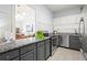Cozy kitchen with stainless steel appliances, gray cabinets, and granite countertops at 130 26Th Nw St # 511, Atlanta, GA 30309