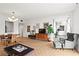 Sun-filled living room featuring hardwood floors, a comfortable armchair and stylish decor at 130 26Th Nw St # 511, Atlanta, GA 30309