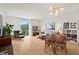 Open-concept living and dining area with large windows and hardwood floors at 130 26Th Nw St # 511, Atlanta, GA 30309