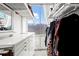 Spacious walk-in closet with custom shelving and drawers and a view at 130 26Th Nw St # 511, Atlanta, GA 30309