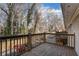 Cozy wooden balcony overlooking a wooded area with trees in an urban neighborhood at 2232 Dunseath Nw Ave # 302, Atlanta, GA 30318