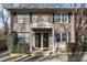 Charming brick townhome with a covered entrance and black shutters at 2232 Dunseath Nw Ave # 302, Atlanta, GA 30318