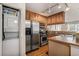 Efficient kitchen layout with stackable laundry and stainless steel appliances at 2232 Dunseath Nw Ave # 302, Atlanta, GA 30318