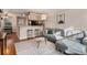 Inviting living room with hardwood floors, gray sofa, and an open kitchen at 2232 Dunseath Nw Ave # 302, Atlanta, GA 30318