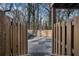 View of the parking lot from the end of a wooden walkway at 2232 Dunseath Nw Ave # 302, Atlanta, GA 30318