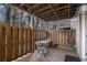 Outdoor patio area featuring a small table, chairs, and privacy fencing at 2232 Dunseath Nw Ave # 302, Atlanta, GA 30318