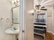 Half-bathroom with pedestal sink and a view of the breakfast nook at 2232 Dunseath Nw Ave # 302, Atlanta, GA 30318