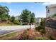 Community entrance with brick signage and manicured flower beds at 'The Views at Lenox Crossing' at 2316 Limehurst Ne Dr, Atlanta, GA 30319