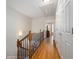 Upstairs hallway with wood floors and nice lighting at 2316 Limehurst Ne Dr, Atlanta, GA 30319