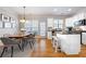Bright kitchen and dining area features white cabinetry, stainless appliances, and hardwood floors at 2316 Limehurst Ne Dr, Atlanta, GA 30319