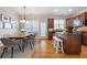 Updated kitchen and dining area features wood cabinetry, stainless appliances, and hardwood floors at 2316 Limehurst Ne Dr, Atlanta, GA 30319
