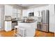 This modern kitchen features stainless steel appliances, white cabinets, and granite countertops at 2316 Limehurst Ne Dr, Atlanta, GA 30319