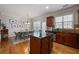 Open concept kitchen with wood cabinets, granite countertops, stainless appliances, and breakfast area at 2316 Limehurst Ne Dr, Atlanta, GA 30319