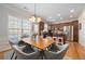 Open concept kitchen and dining area features stainless appliances and wood cabinets at 2316 Limehurst Ne Dr, Atlanta, GA 30319