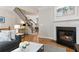 Cozy living room showcasing a fireplace, hardwood floors, and staircase, creating a warm and inviting space at 2316 Limehurst Ne Dr, Atlanta, GA 30319