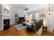 Bright living room with hardwood floors, a fireplace, and modern decor, creating an inviting atmosphere at 2316 Limehurst Ne Dr, Atlanta, GA 30319