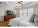 Bright main bedroom with dresser, ceiling fan, and many windows at 2316 Limehurst Ne Dr, Atlanta, GA 30319