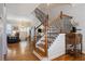 Beautiful staircase with wood railings, iron spindles, and hardwood floors at 2316 Limehurst Ne Dr, Atlanta, GA 30319