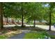Street view of homes with tree lined streets, sidewalks, and manicured front lawns at 2316 Limehurst Ne Dr, Atlanta, GA 30319
