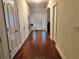 A foyer with hardwood floors leads to a bright white front door at 114 Crescent Woode Way, Dallas, GA 30157