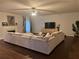 Cozy living room with plush sectional sofa, fireplace, and hardwood floors at 114 Crescent Woode Way, Dallas, GA 30157