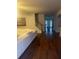 Living room with hardwood floors, staircase, and a comfortable white sofa at 114 Crescent Woode Way, Dallas, GA 30157