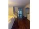 Bright living room featuring hardwood floors, a staircase, and ample natural light at 114 Crescent Woode Way, Dallas, GA 30157