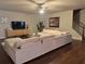Spacious living room with large sectional sofa and hardwood floors at 114 Crescent Woode Way, Dallas, GA 30157