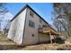 Spacious back exterior featuring a wooden deck and basement access at 624 Longbow Ct, Stone Mountain, GA 30087