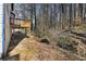 View of the backyard including a deck, natural foliage, and the back of the home at 624 Longbow Ct, Stone Mountain, GA 30087