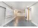 Unfinished basement with gray floor, and a whiteboard with door leading upstairs at 624 Longbow Ct, Stone Mountain, GA 30087