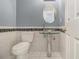 Powder room featuring pedestal sink and tile accents at 624 Longbow Ct, Stone Mountain, GA 30087