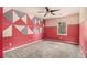 This bedroom features unique decorative wall art, and a ceiling fan at 624 Longbow Ct, Stone Mountain, GA 30087