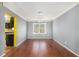 Dining room featuring hardwood floors, modern lighting, and a view to the side yard at 624 Longbow Ct, Stone Mountain, GA 30087