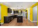 Spacious kitchen with modern stainless steel appliances, granite countertops, and dark wood cabinets at 624 Longbow Ct, Stone Mountain, GA 30087