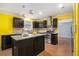 Well-equipped kitchen features modern stainless steel appliances, granite countertops, and dark wood cabinets at 624 Longbow Ct, Stone Mountain, GA 30087