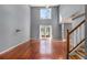 Spacious living room with high ceilings, hardwood floors, a ceiling fan and a staircase at 624 Longbow Ct, Stone Mountain, GA 30087