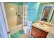Bright bathroom featuring a shower-tub combo, with a neutral-colored sink vanity at 85 Tanglewood Dr, Covington, GA 30016