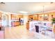 Spacious kitchen with wooden cabinets, tiled floors, and a breakfast bar perfect for casual dining at 85 Tanglewood Dr, Covington, GA 30016