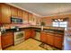 Well-equipped kitchen with stainless steel appliances, granite countertops, and ample cabinet space at 85 Tanglewood Dr, Covington, GA 30016
