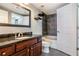 Bathroom featuring a sleek vanity with a dark countertop and a tiled shower-tub combination at 275 13Th St # Apt 509, Atlanta, GA 30309
