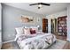Bedroom with hardwood flooring, lots of natural light, and large bookcase next to the closet at 275 13Th St # Apt 509, Atlanta, GA 30309