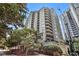 Elegant high-rise building showcasing modern architecture and beautiful landscaping, offering luxurious urban living at 275 13Th St # Apt 509, Atlanta, GA 30309