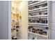 Pantry features shelving with clear food storage containers and a large selection of herbs and spices at 275 13Th St # Apt 509, Atlanta, GA 30309