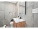 Modern bathroom featuring gray-tiled walls, contemporary vanity, and sleek fixtures at 3080 Hamilton Rd, Decatur, GA 30032