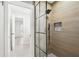 Modern bathroom featuring glass shower door, wood-look tiling and contemporary fixtures at 3080 Hamilton Rd, Decatur, GA 30032