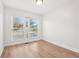 Neutral bedroom with light floors and large window at 3080 Hamilton Rd, Decatur, GA 30032