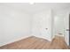 Bright bedroom with wood floors and a white door to a bathroom or closet at 3080 Hamilton Rd, Decatur, GA 30032