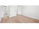 Spacious bedroom with wood-look floors, neutral walls, and white trim at 3080 Hamilton Rd, Decatur, GA 30032